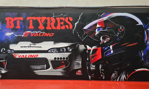 BT Tyres mural featuring an S15 Valino drift car and driver in red and black.