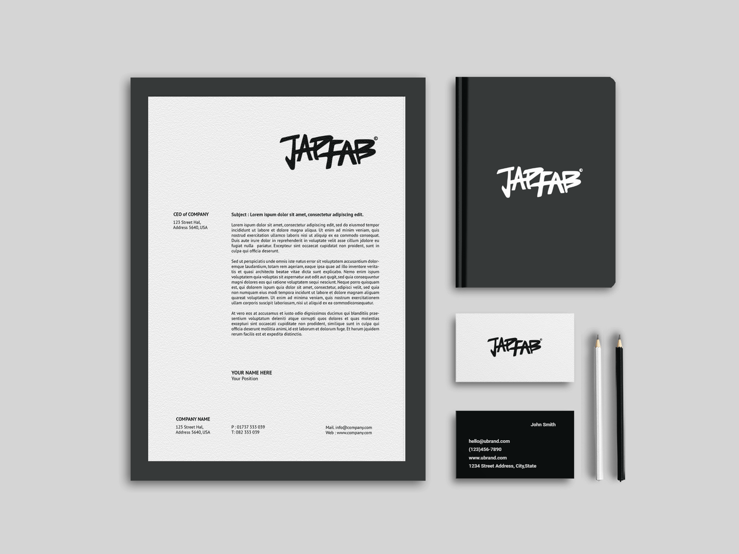 Custom stationery set for JapFab, including branded pens, notepads, and cards for cohesive brand presence