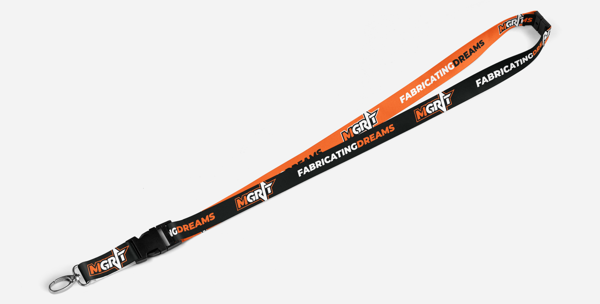 Custom lanyard design for MGRF, featuring 'Fabricating Dreams' branding in bold black and orange colours